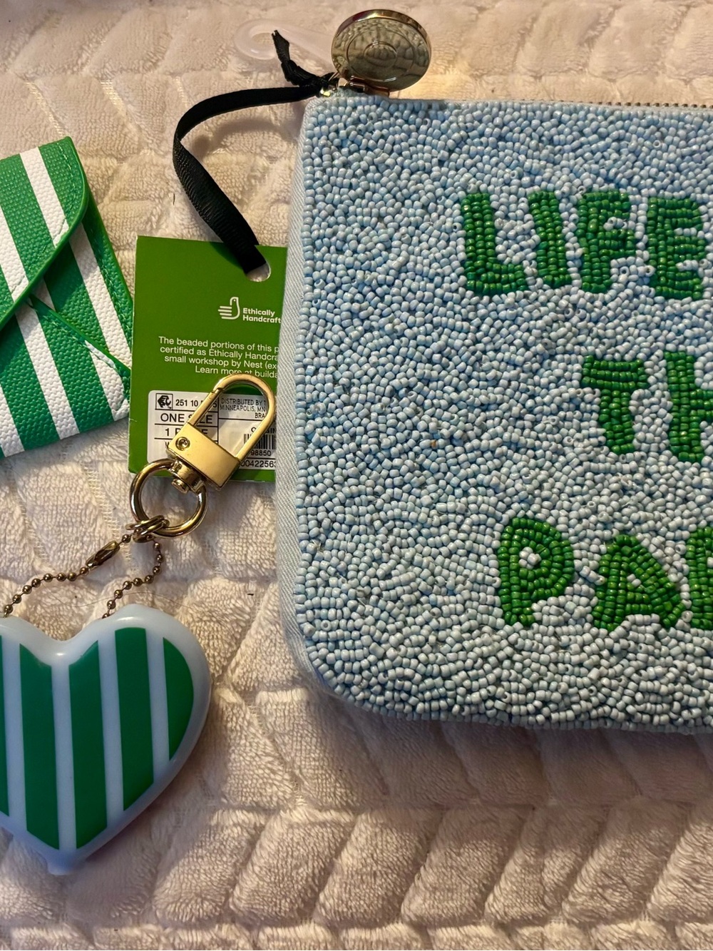 kate spade light blue beaded mini pouch with green lettering